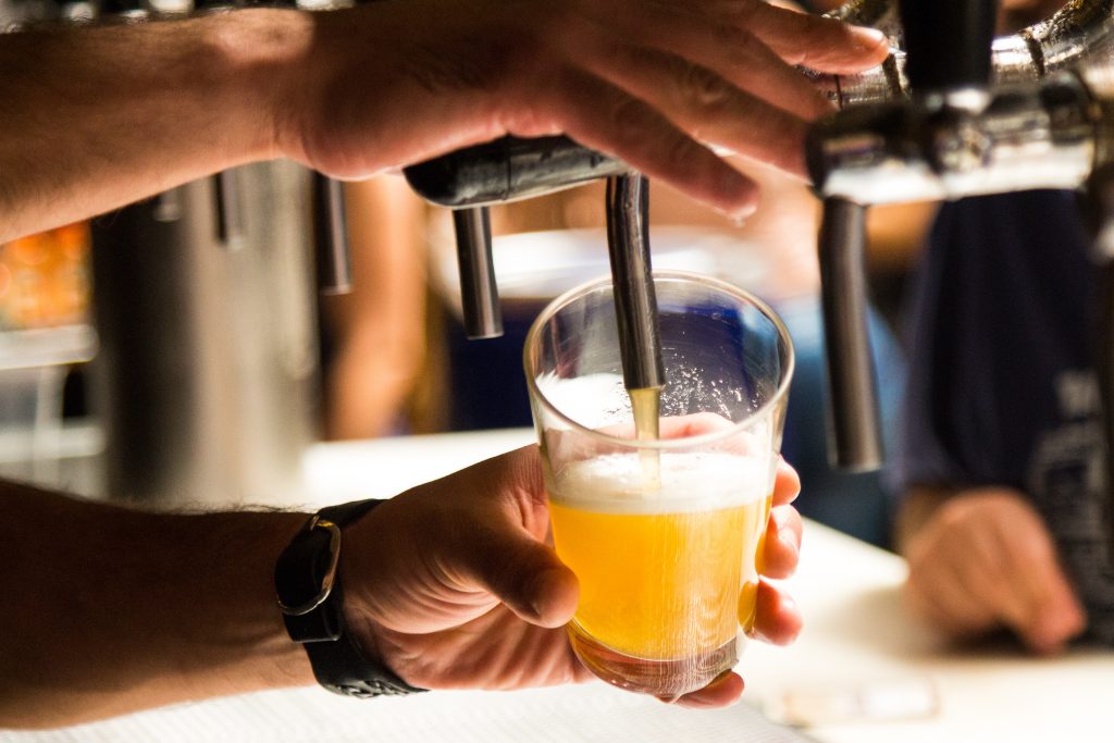 Bartender Pouring A Draft Beer