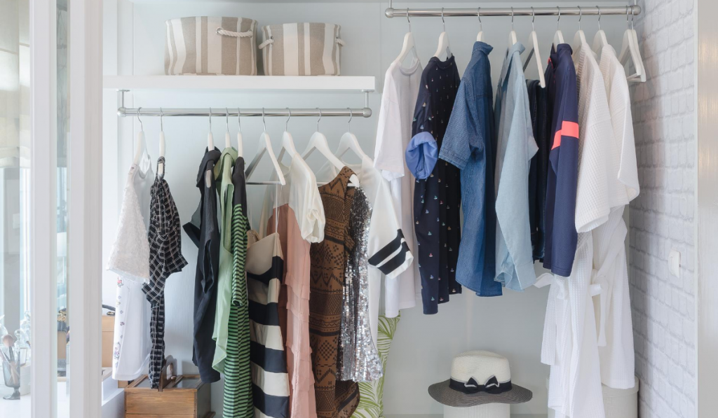 clean white organized bedroom closet