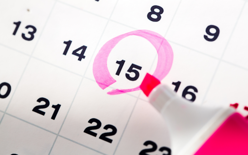 pink highlighter circling date on calendar 15th