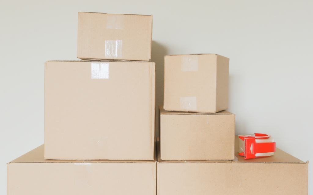 stack of moving boxes with packing tape