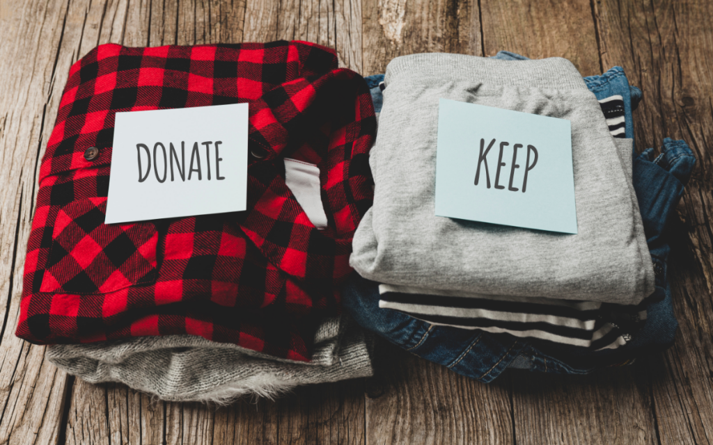 two piles of clothing donate keep decluttering