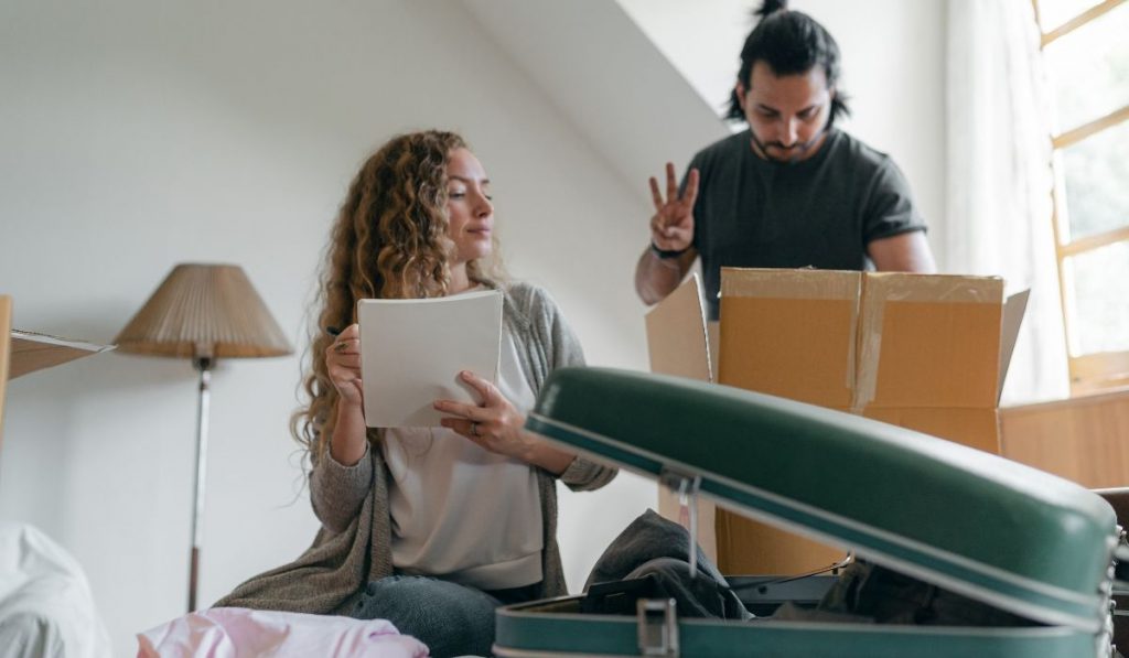 couple making a list of moving out stuff