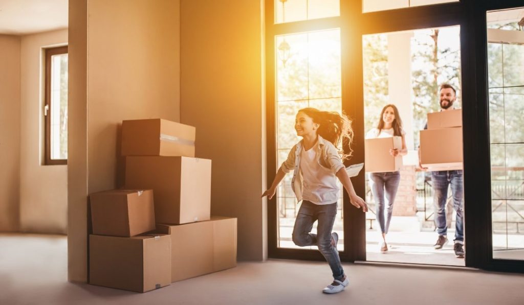 family entering their new house