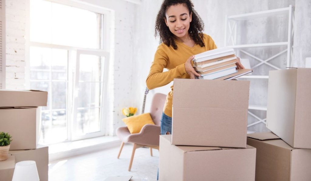 girl checking stuff inside a box