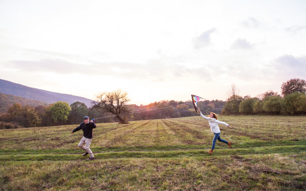 senior couple flying a kite