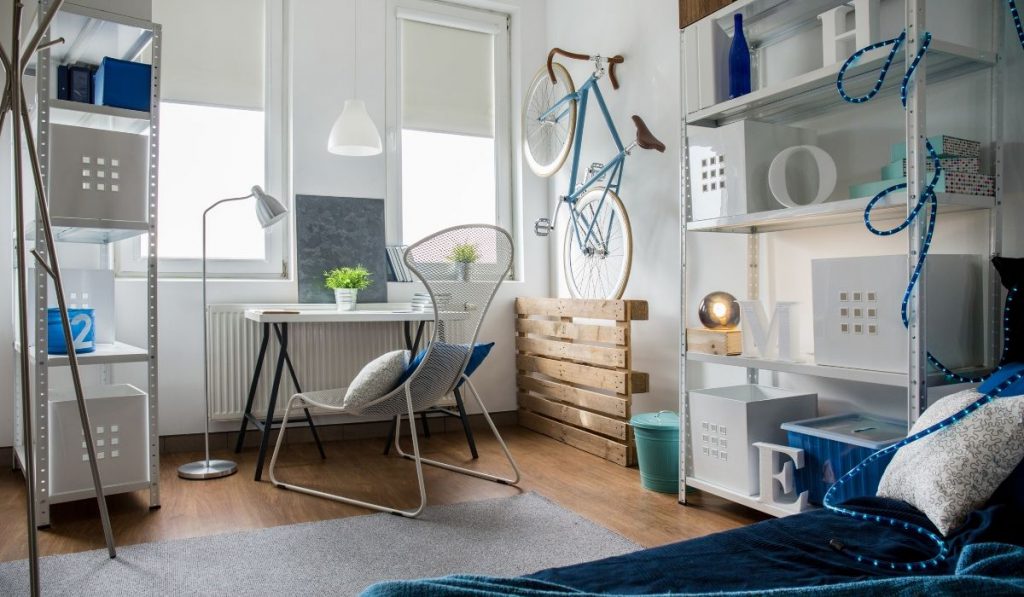 micro apartment with a steel welded storage rack; white and blue colors