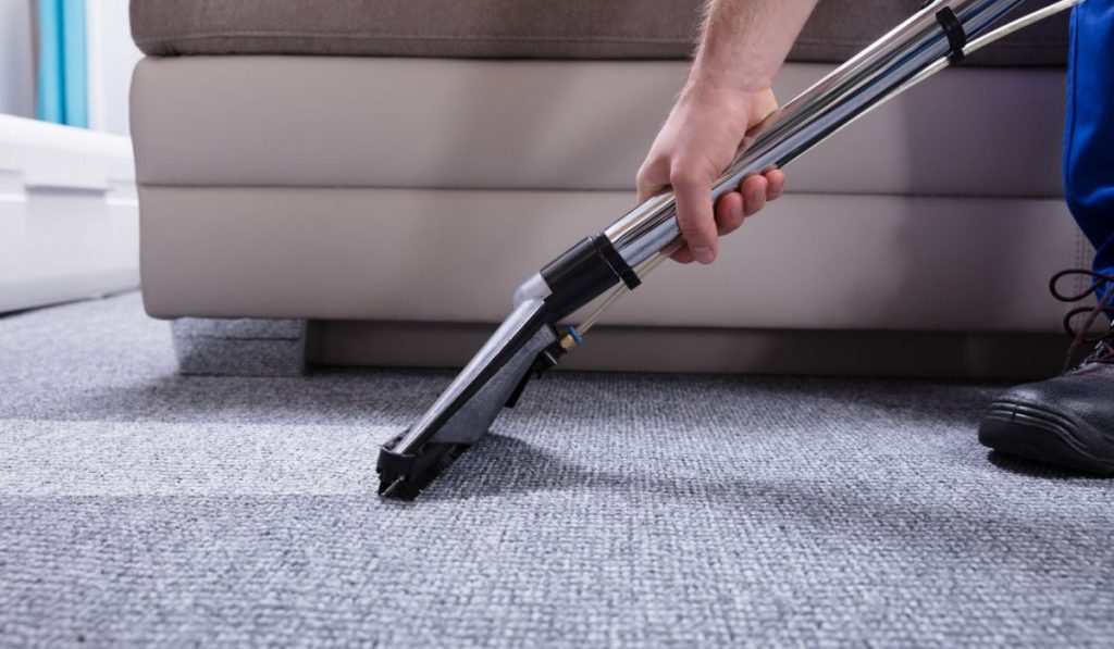 vacuuming the carpet