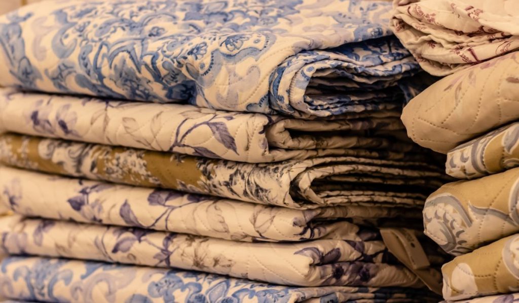 pile of bedsheets neatly folded 