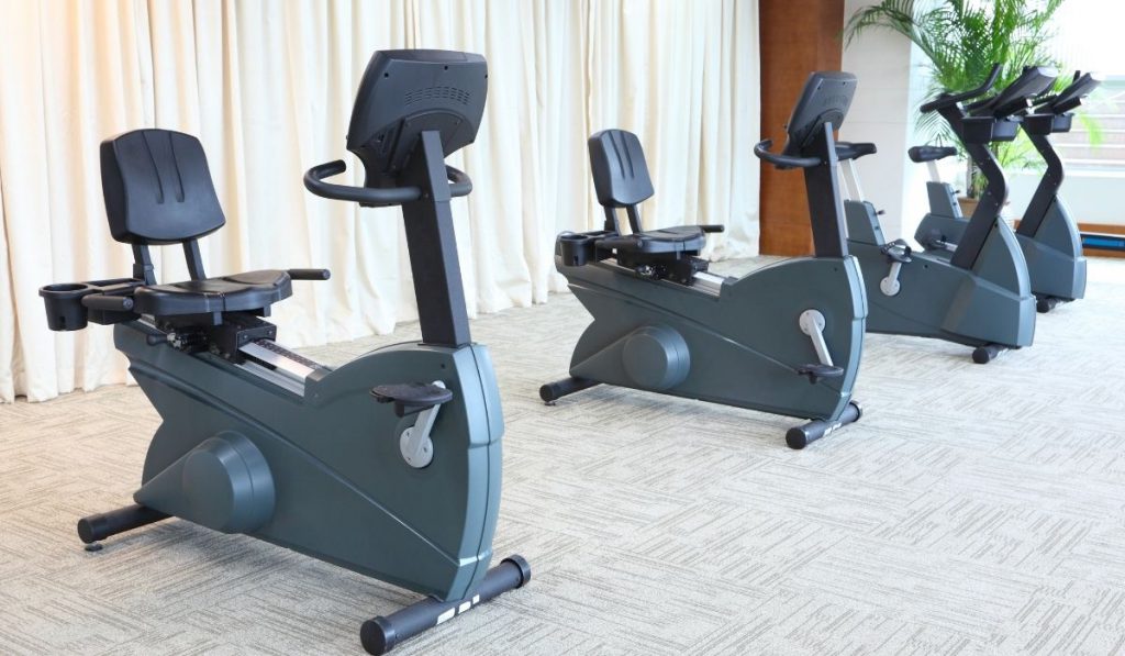 4 gray stationary bikes indoor