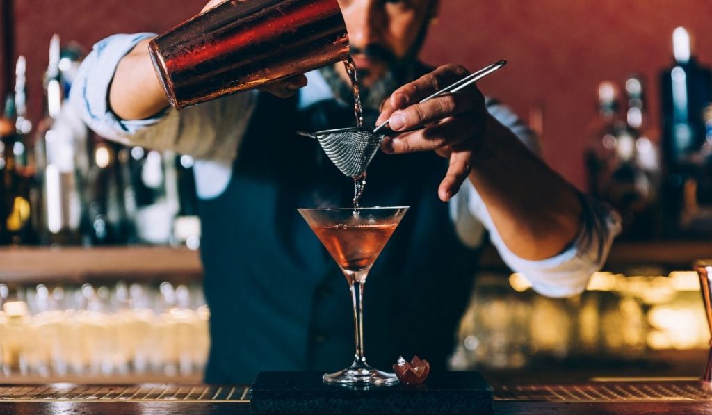 bartender mixing a custom cocktail