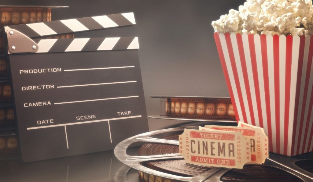 clapper board film popcorn and tickets