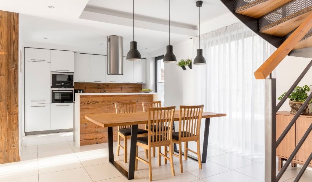 staged dining and kitchen area, wood and white theme