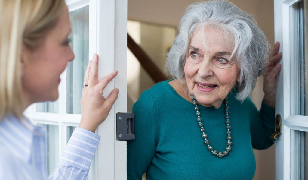 lady asking a neighbor for help