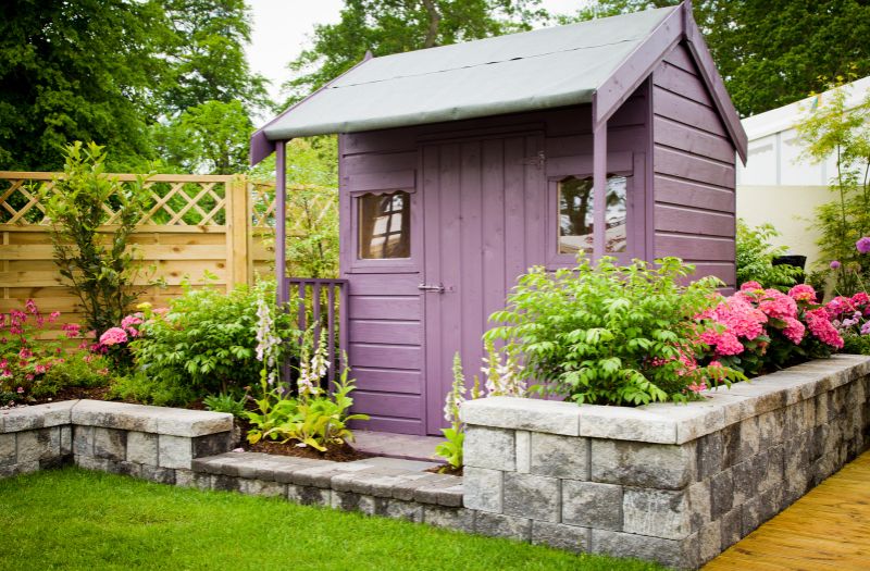 purple outdoor storage shed in the garden