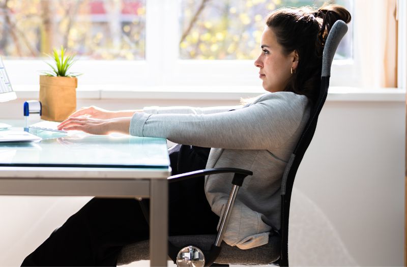 woman sitting comfortably on her office chair at home