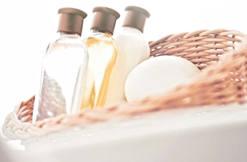 bathroom essentials in a wooden basket