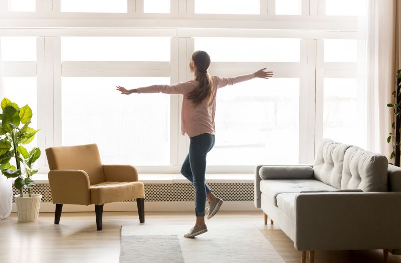 woman loves the space of her new house