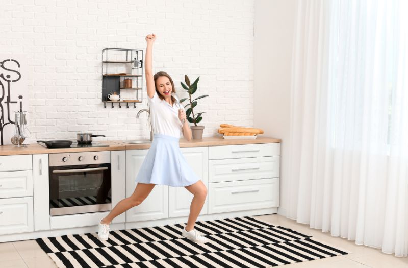 woman singing her heart out while cooking