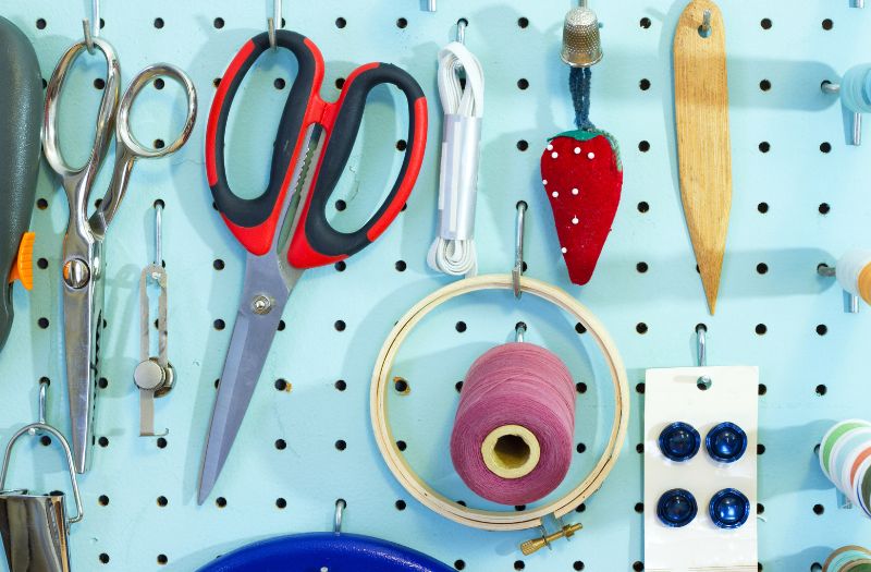 pegboard with sewing tools and supplies