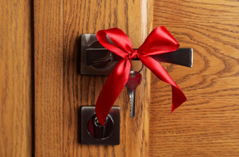 red ribbon on house door lock