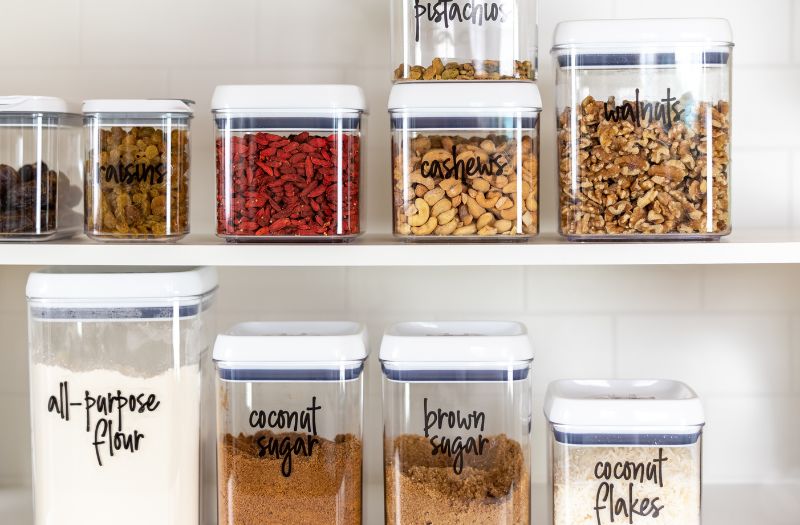 storage containers in the pantry for nuts, baking supplies