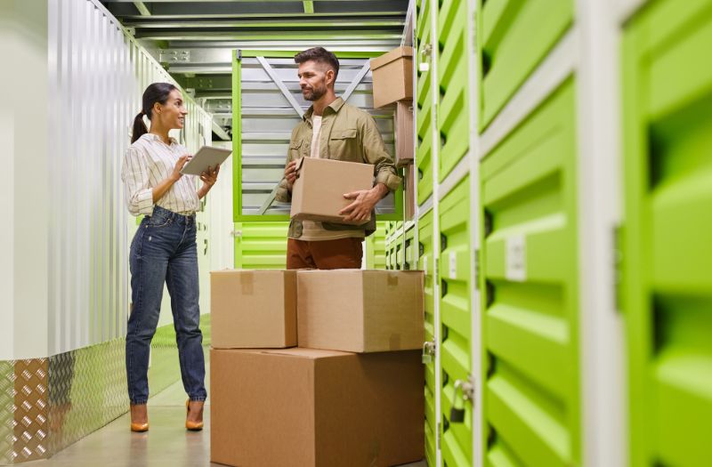 couple checking their storage boxes to keep