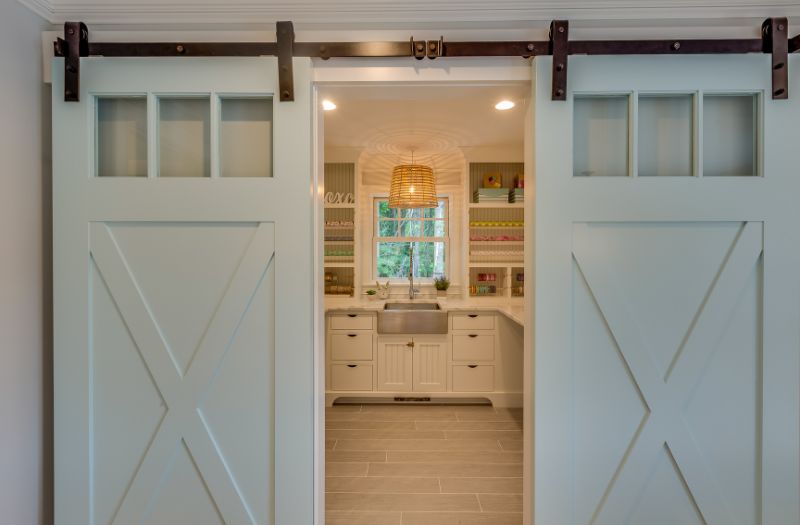 organized pantry with barn doors