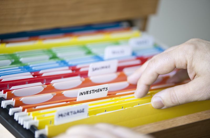 filing cabinet of important documents with labels