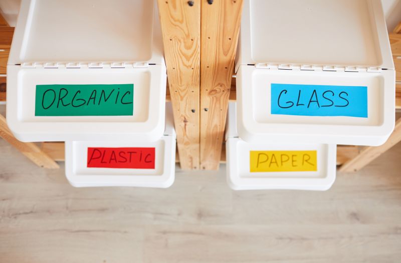 recycling containers with colored labels