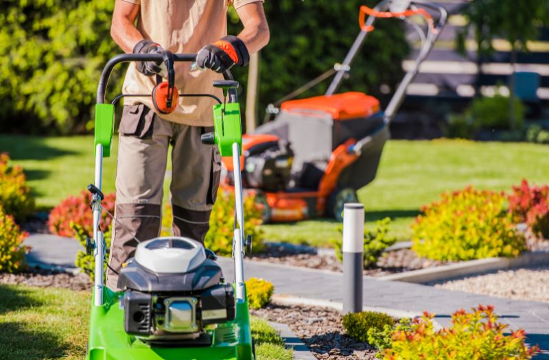 man using a lawnmower