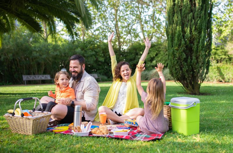 family enjoying their picnic at the park