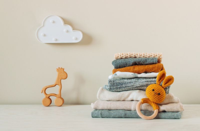 some baby clothes and toys